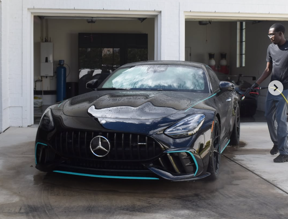 A1 technician hand washing a Mercedes-AMG